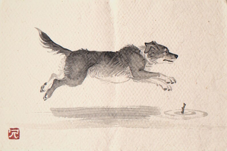 Xieyi Ink Dog Chasing Stick Into Surf Print framed in a home office setting