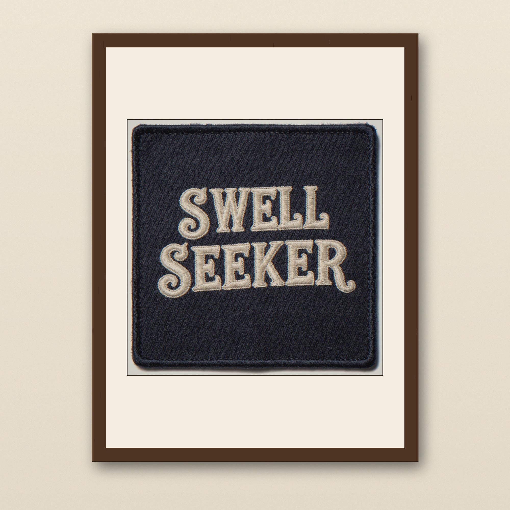 Swell Seeker Embroidered Patch Print - walnut framed art print with cream mat on plaster wall