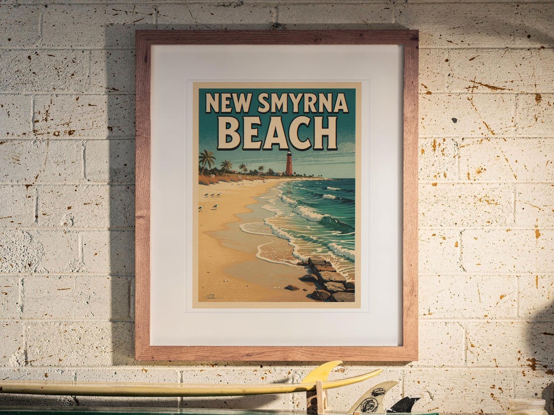New Smyrna Beach Surf Travel Poster print in a Red Oak frame with a white mat, hanging above the workbench in a surf garage.