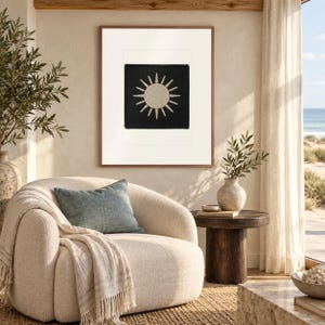 Sun Patch print in a Red Oak frame with a white mat in a light-filled coastal sitting room.