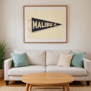 Malibu Vintage Surf Pennant Print framed in a beach-style living room setting
