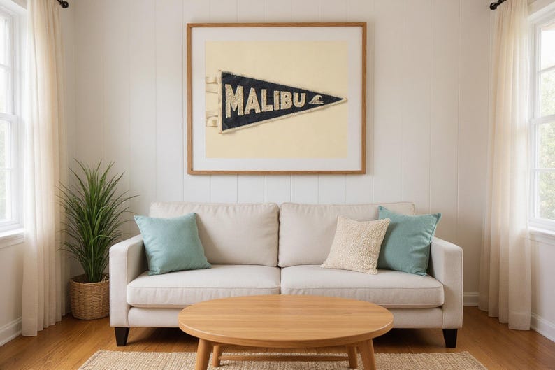 Malibu Vintage Surf Pennant Print framed in a beach-style living room setting