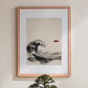 Wave Ink Style print in a Red Oak frame with a white mat, leaning against the wall above the tea table in a tea room.