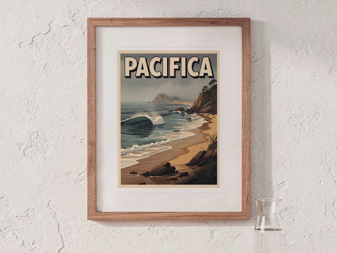 Pacifica Surf Travel Poster print in a Red Oak frame with a white mat, hanging above the bedside table in a calm bedroom.