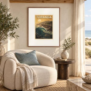 Topanga Surf print in a Red Oak frame with a white mat in a light-filled coastal sitting room.