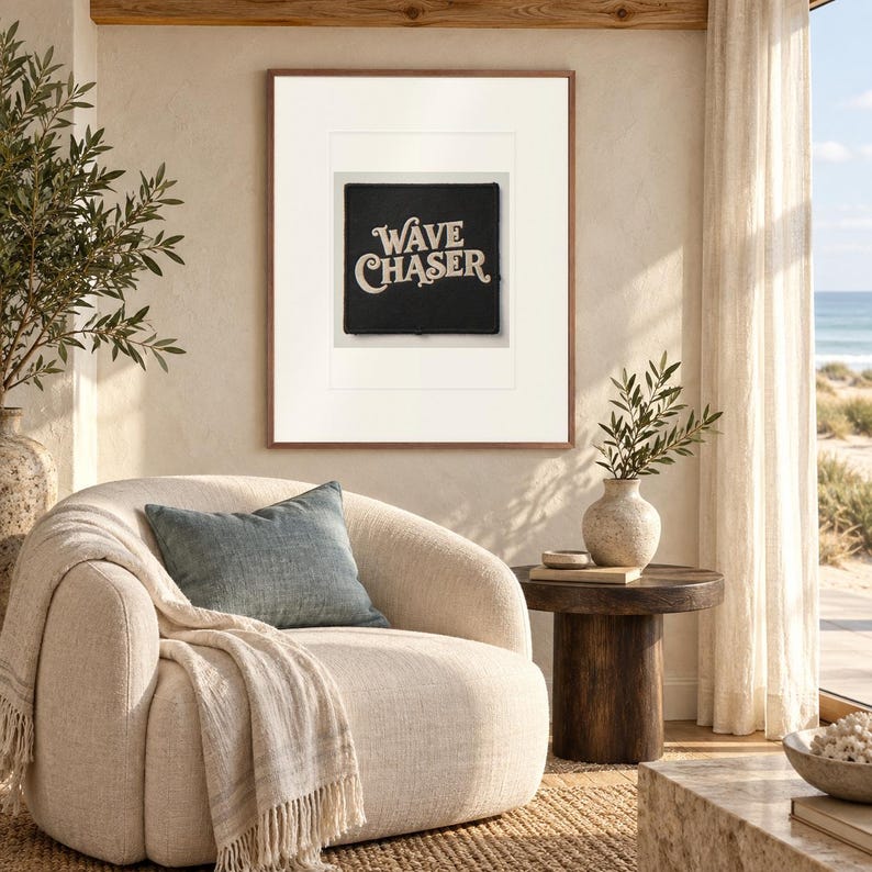 Wave Chaser Patch print in a Red Oak frame with a white mat in a light-filled coastal sitting room.