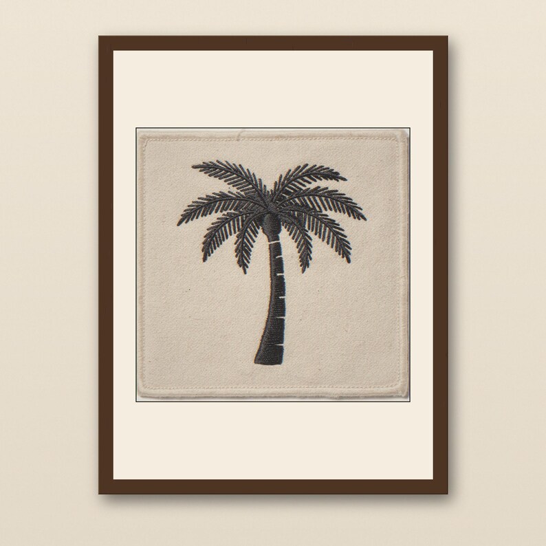 Palm Tree Embroidered Patch Print - walnut framed art print with cream mat on plaster wall