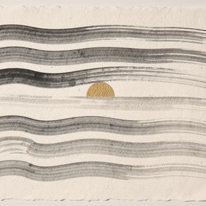 Sumi-e Seven Waves with Gold Accent Print framed in a coastal dining room setting