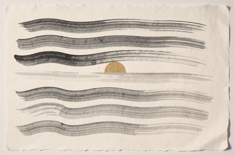 Sumi-e Seven Waves with Gold Accent Print framed in a coastal dining room setting