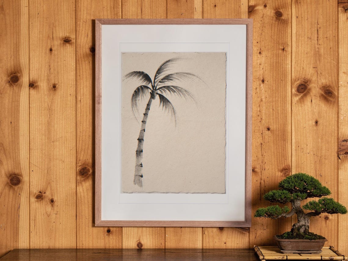 Lone Palm Tree Ink Style print in a Red Oak frame with a white mat, hanging above the cabinet in a tea room.