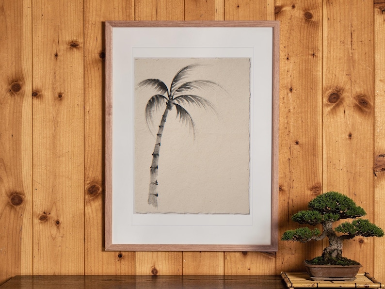 Lone Palm Tree Ink Style print in a Red Oak frame with a white mat, hanging above the cabinet in a tea room.