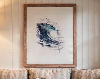 May include: A framed watercolor painting of a crashing ocean wave in shades of deep blue, teal, and white. The artwork features expressive paint splatters and fluid brushstrokes, encased in a simple, light-toned wooden frame with a white mat.