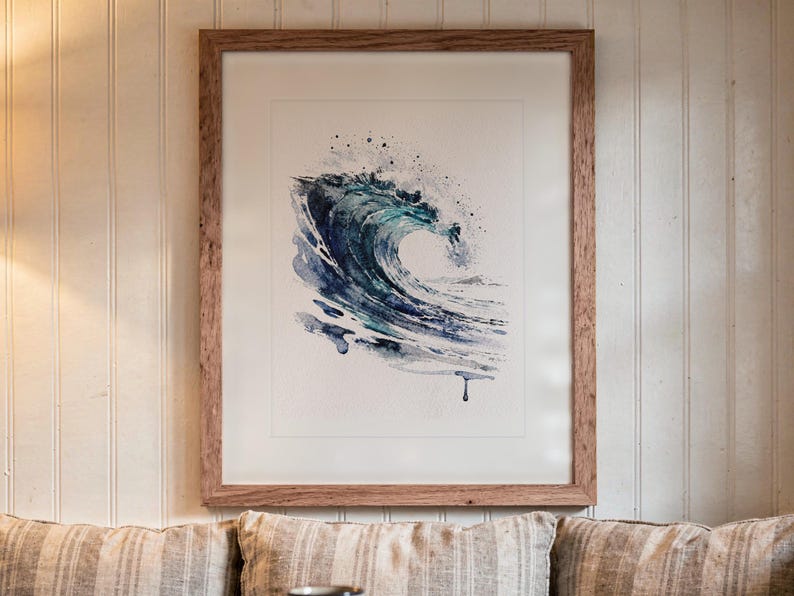 Glass Curl Wave Watercolor print in a Red Oak frame with a white mat, hanging above the bench in a breakfast nook.