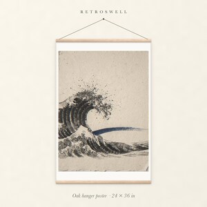 Crashing Wave Ink Style oak hanger poster, 24 by 36 inches, with natural wood rails and a hanging cord.
