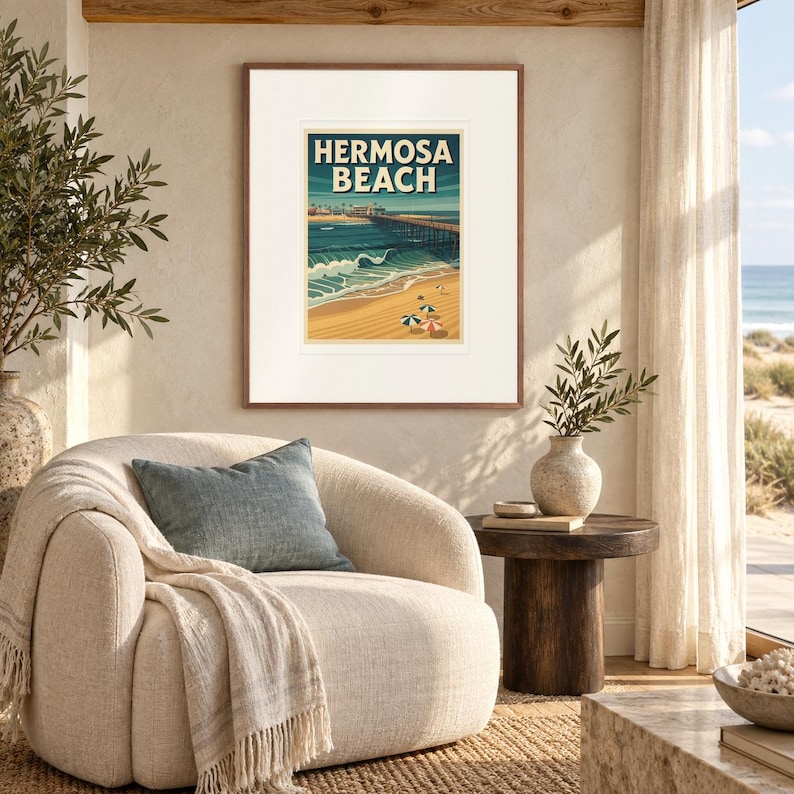 Hermosa Beach Surf print in a Red Oak frame with a white mat in a light-filled coastal sitting room.