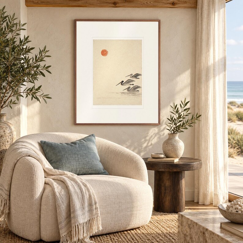 Pelicans Ink Style print in a Red Oak frame with a white mat in a light-filled coastal sitting room.