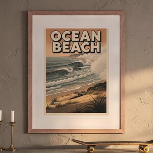 Ocean Beach San Diego Surf Travel Poster print in a Red Oak frame with a white mat, hanging above the buffet in a dining room.