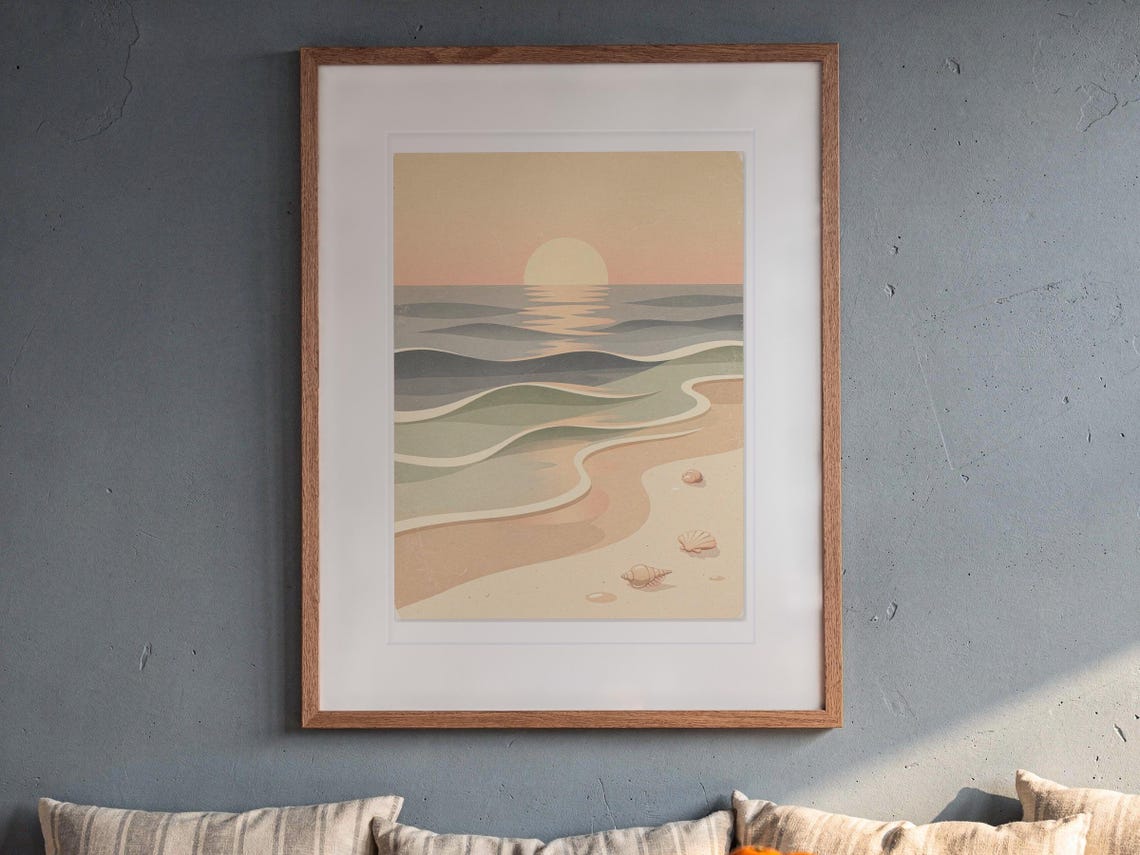 Pastel Sunset Shoreline Nursery print in a Red Oak frame with a white mat, hanging above the bench in a breakfast nook.