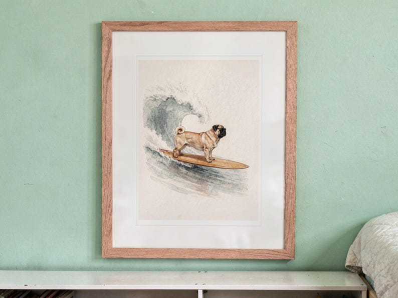 Pug Surfing printable art, shown printed in a Red Oak frame with a white mat, hanging above the bookshelf in a kids' room.