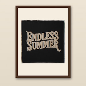 May include: A framed art print featuring the words "ENDLESS SUMMER" in a vintage-style font. The text is in a light tan color against a black background, with a brown frame.