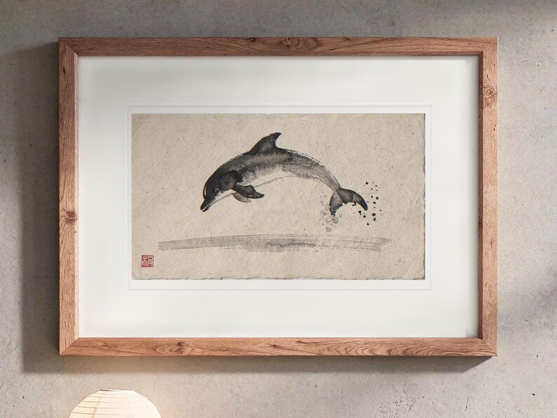Leaping Dolphin Xieyi Ink print in a Red Oak frame with a white mat, hanging above the console in a japandi living room.