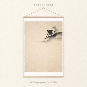 Surfer Cutback Ink Style oak hanger poster, 24 by 36 inches, with natural wood rails and a hanging cord.