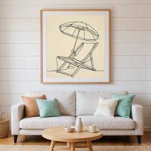 Boho Beach Chair and Umbrella Line Art framed in a beach-style living room setting