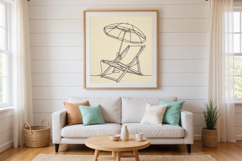Boho Beach Chair and Umbrella Line Art framed in a beach-style living room setting
