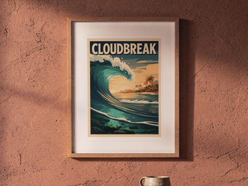 Cloudbreak Fiji Surf Poster printable art, shown printed in a Red Oak frame with a white mat, hanging above the table in a boho living room.