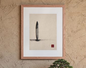 May include: A framed wall art piece featuring a vertical black ink brush stroke resembling a surfboard shape on textured beige paper. A horizontal black ink line sits at the base, and a small solid red square is positioned in the lower right corner.