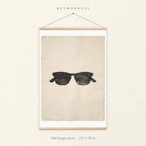 Wayfarer Sunglasses Sumi-e Ink oak hanger poster, 24 by 36 inches, with natural wood rails and a hanging cord.