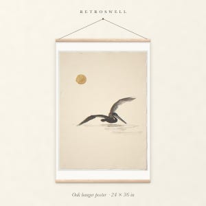 Flying Pelican Ink Style oak hanger poster, 24 by 36 inches, with natural wood rails and a hanging cord.