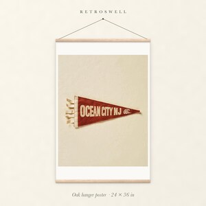 Ocean City, New Jersey Surf Pennant oak hanger poster, 24 by 36 inches, with natural wood rails and a hanging cord.