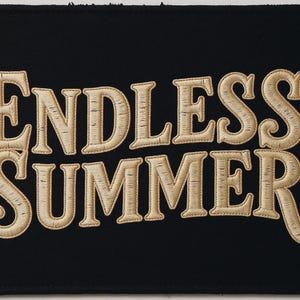 Endless Summer Embroidered Patch Print framed in a modern bedroom setting