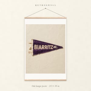 Biarritz, France Surf Pennant oak hanger poster, 24 by 36 inches, with natural wood rails and a hanging cord.