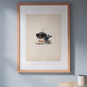 Whale Surfing print in a Red Oak frame with a white mat, hanging above the bench in a breakfast nook.