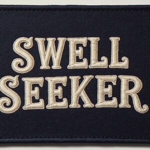 Swell Seeker Embroidered Patch Print framed in a home office setting