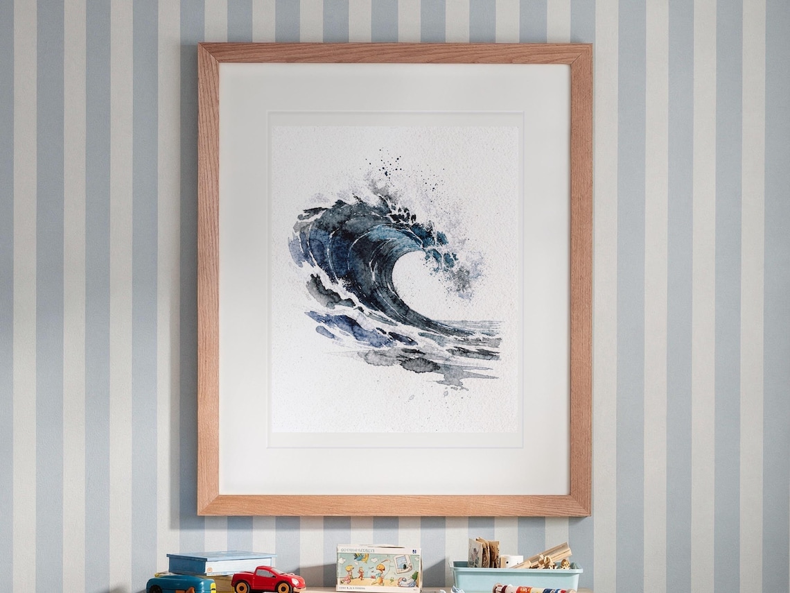 Indigo Barrel Wave Watercolor print in a Red Oak frame with a white mat, hanging above the desk in a kids' room.