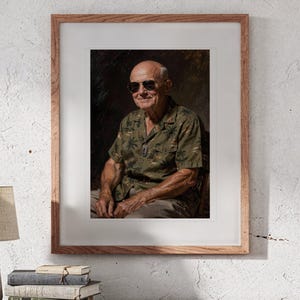 May include: A framed portrait of an older person with a bald head wearing dark sunglasses and an olive green short-sleeved button-down shirt with a palm tree print. The person is seated, facing forward with a subtle smile, against a dark background.