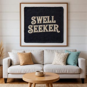 Swell Seeker Embroidered Patch Print framed in a beach-style living room setting