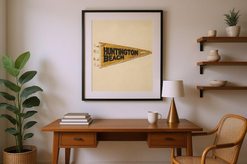 Huntington Beach Vintage Surf Pennant Print framed in a home office setting