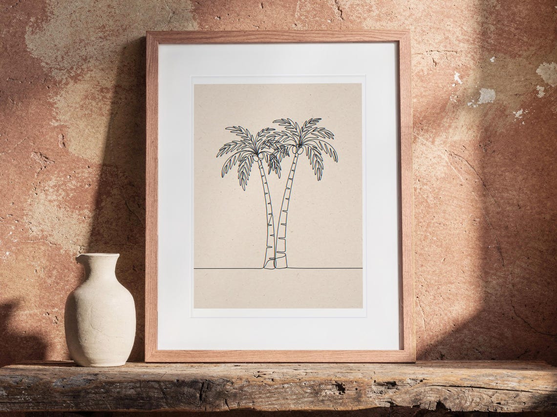 Palm Tree Line print in a Red Oak frame with a white mat, leaning on the bench against the wall in a boho living room.