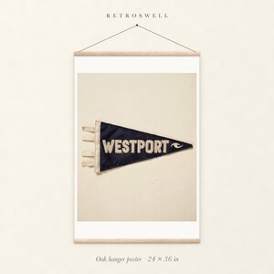 Westport Surf Pennant oak hanger poster, 24 by 36 inches, with natural wood rails and a hanging cord.