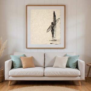 Sumi-e Dawn Patrol Surfer Print framed in a beach-style living room setting
