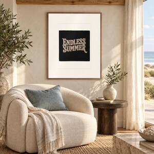 Endless Summer Patch print in a Red Oak frame with a white mat in a light-filled coastal sitting room.