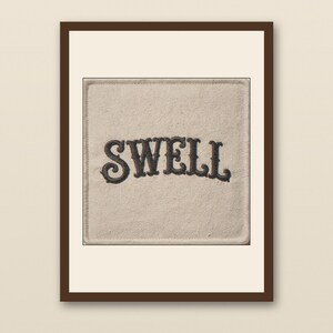 Swell Embroidered Patch Print - walnut framed art print with cream mat on plaster wall