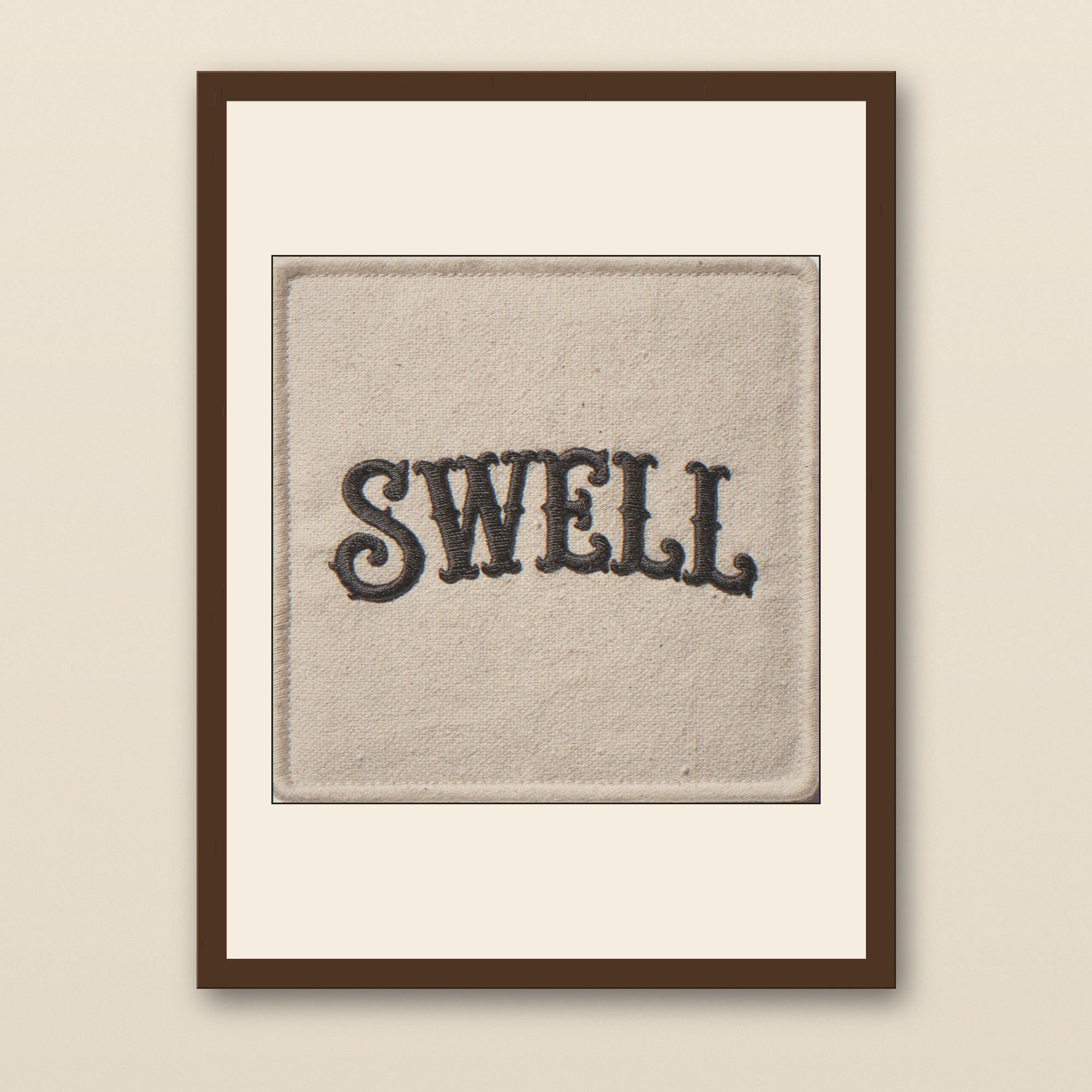 Swell Embroidered Patch Print - walnut framed art print with cream mat on plaster wall
