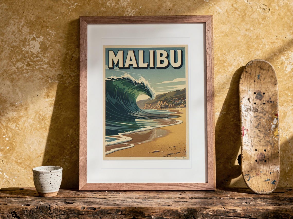 Malibu Surf Travel Poster print in a Red Oak frame with a white mat, leaning on the bench against the wall in a boho living room.