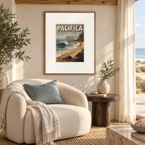 Pacifica Surf print in a Red Oak frame with a white mat in a light-filled coastal sitting room.