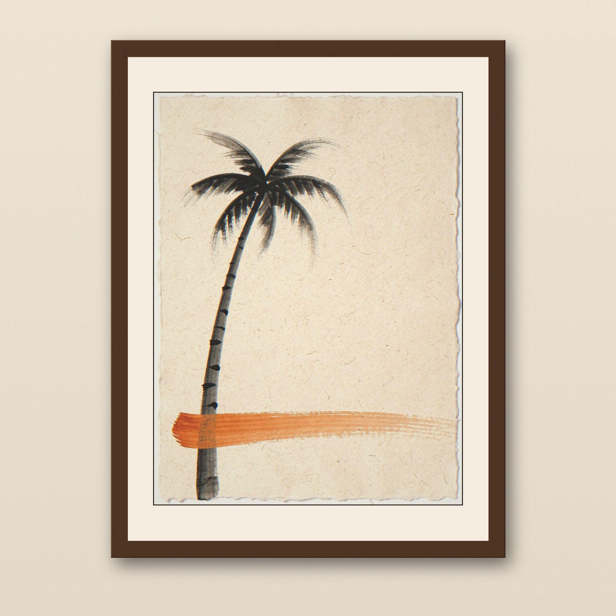 Sumi-e Lone Palm with Sunset Accent Print - walnut framed art print with cream mat on plaster wall